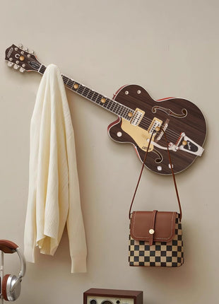 Creative guitar-shaped coat rack decorative painting behind the front key hanger
